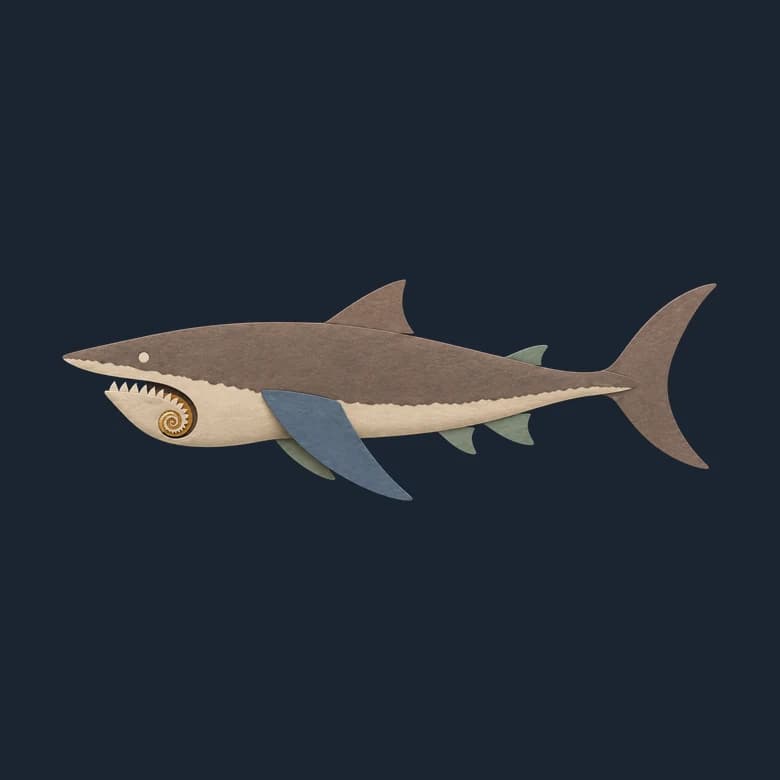 Cut-paper Helicoprion in side view, a shark-shaped fish with a spiral of teeth set in its lower jaw